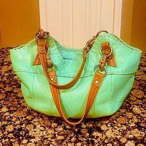 - Gorgeous Vintage The Sak Hand Bag in brand New Condition . Very Classy bag.